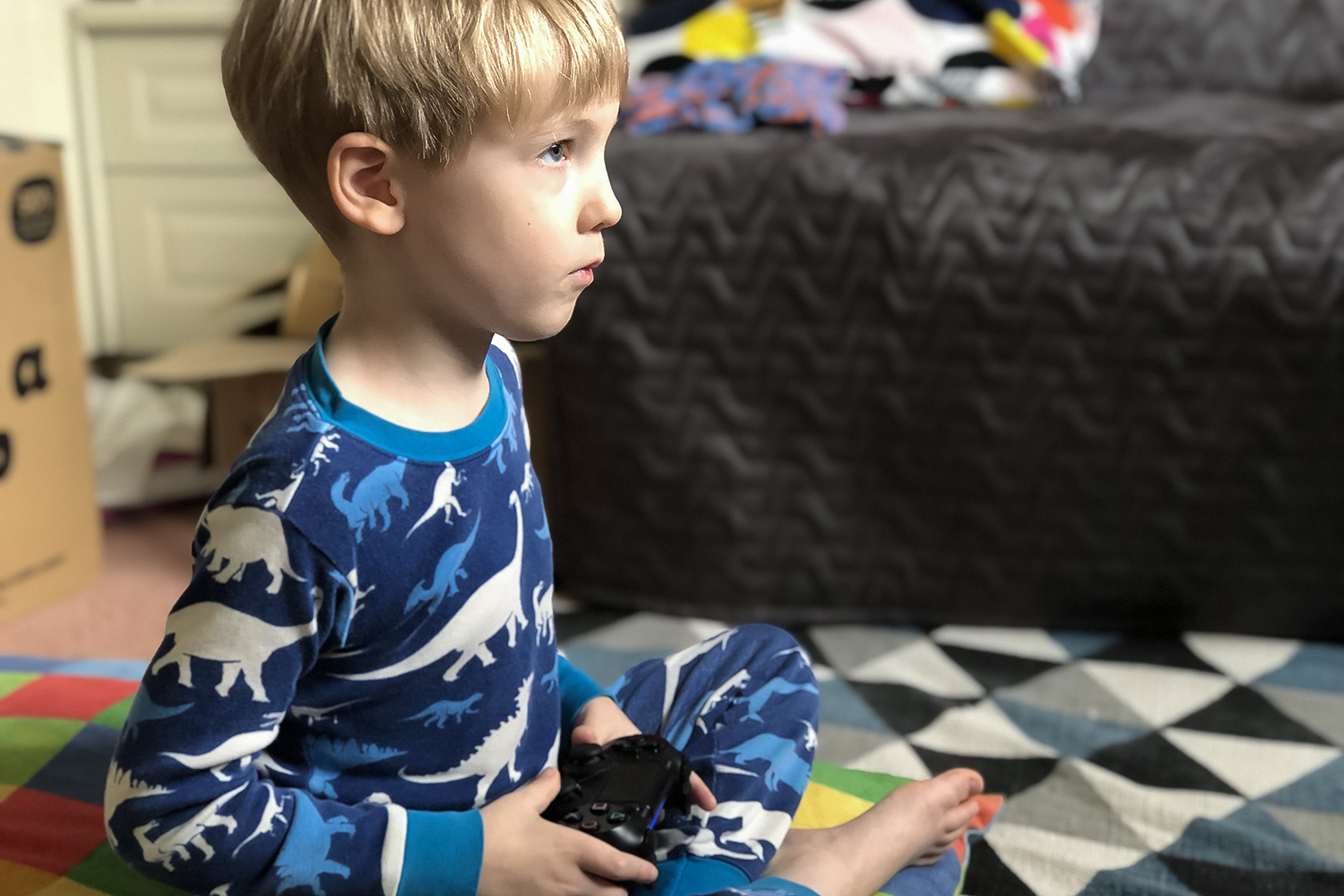 Gabe playing video games in his pyjamas