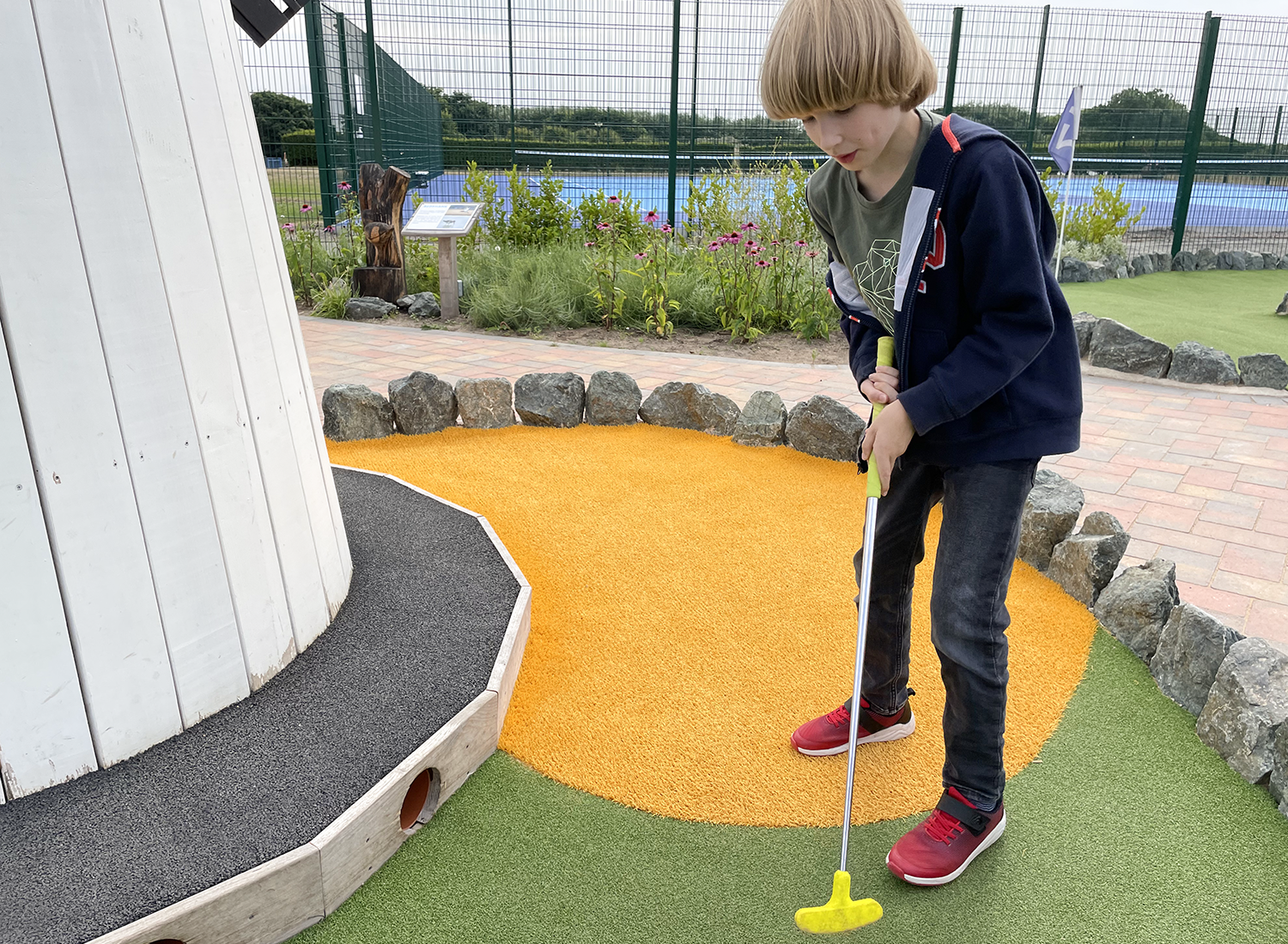 Toby playing crazy golf