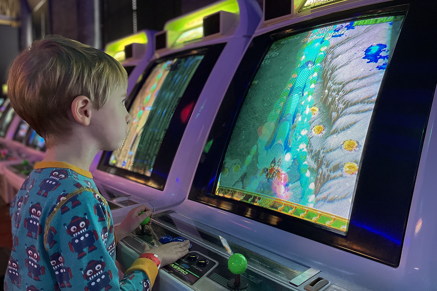 Gabe playing an arcade machine